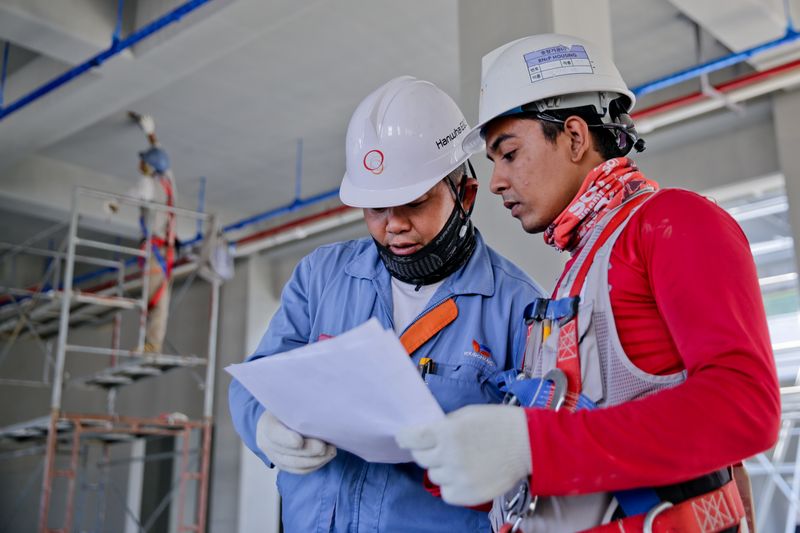 Site staff in industrial uniforms